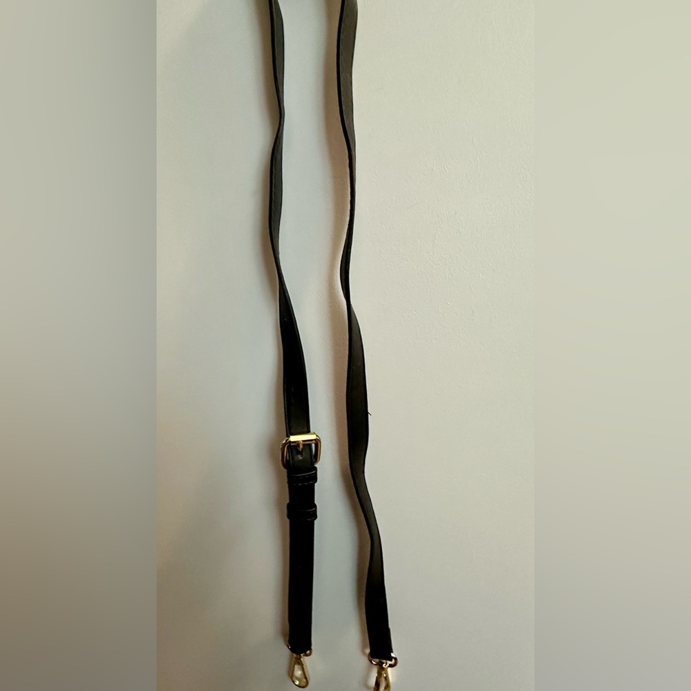 Black crossbody strap. Gold hardware. 52”